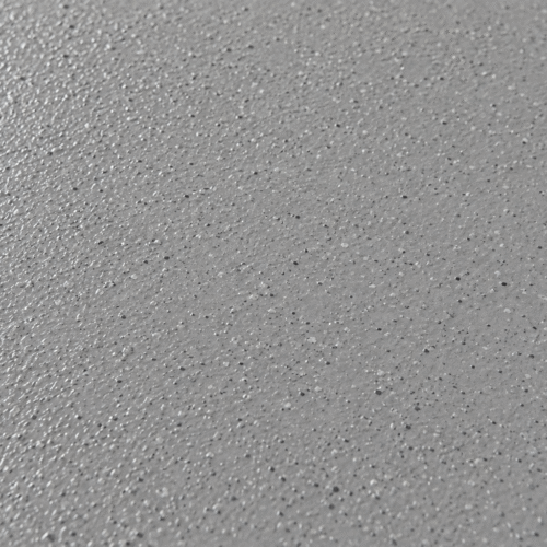 Close-up van een grijze DuraQuartz coating vloer met een fijne, korrelige antislip structuur.