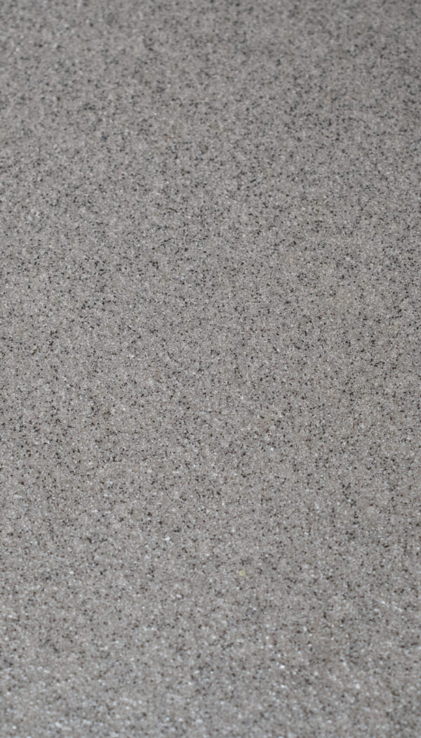 Structuur gietvloer close-up Close-up van gietvloer met gespikkelde flakes structuur in grijstinten